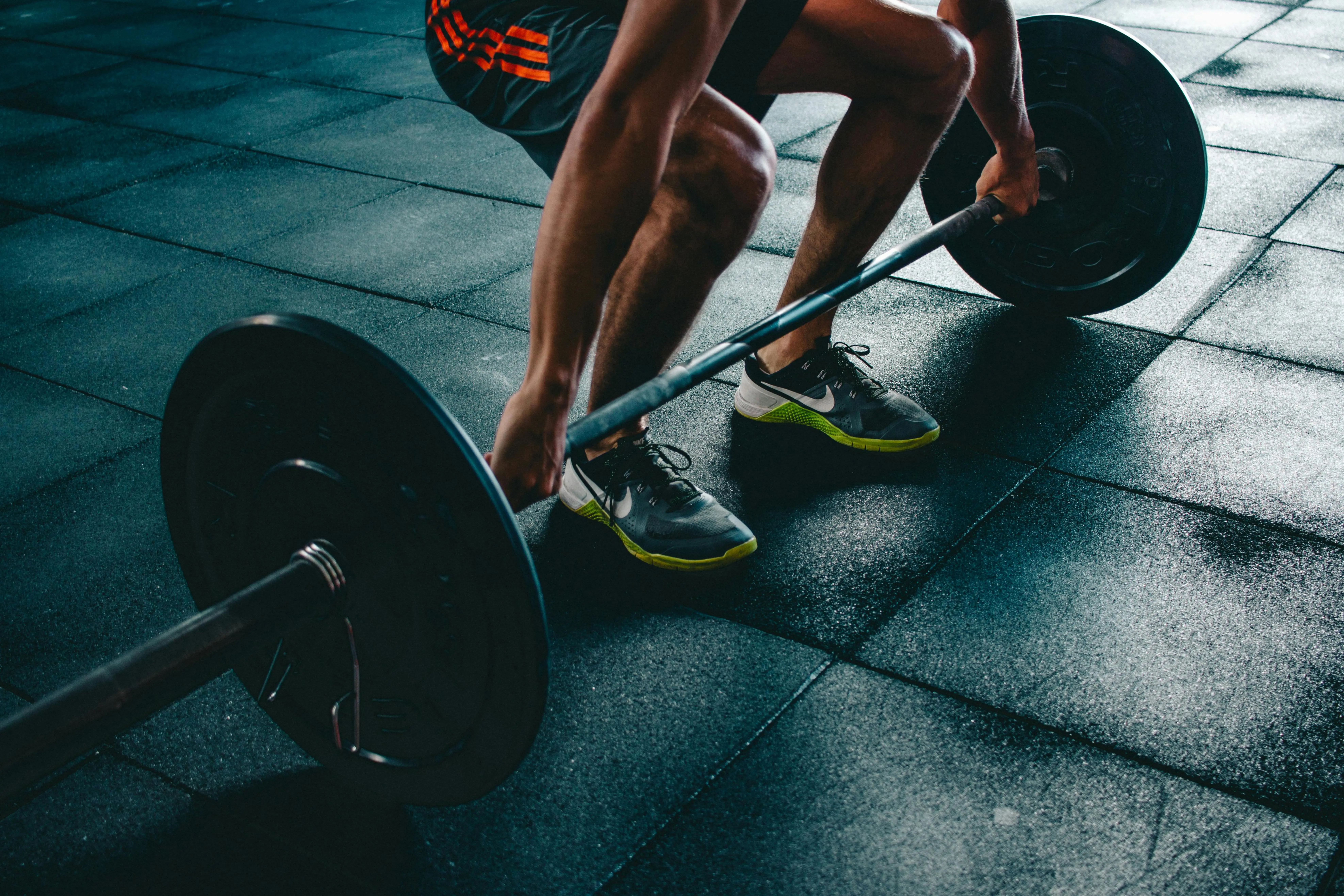 Barbell lift on the gym floor